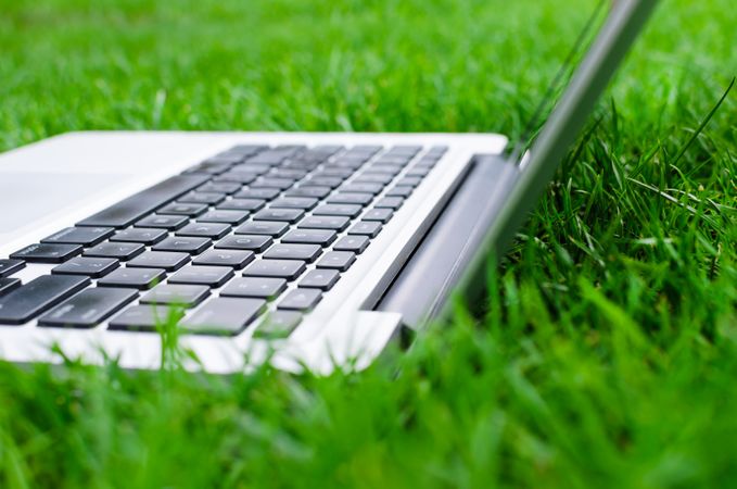 Side View Of Macbook In Lawn Photo