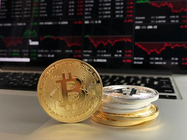 Silver And Gold Bitcoins On Laptop Photo