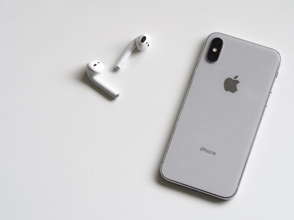 Silver Iphone X With Airpods Photo