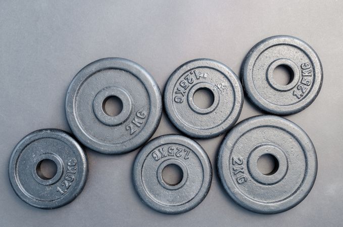 Six Assorted Weight Plates Photo