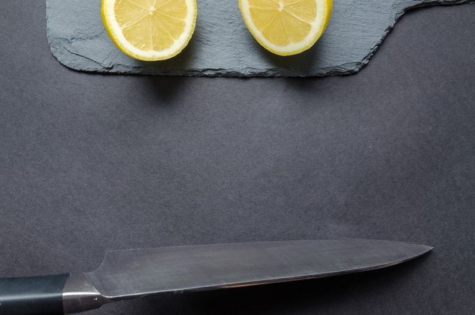 Sliced Lemon And Gray Knife Photo