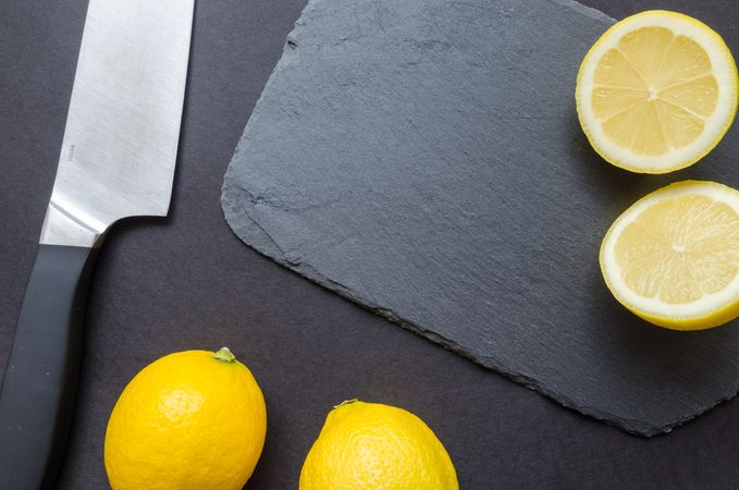 Sliced Lemon Near Kitchen Knife Photo
