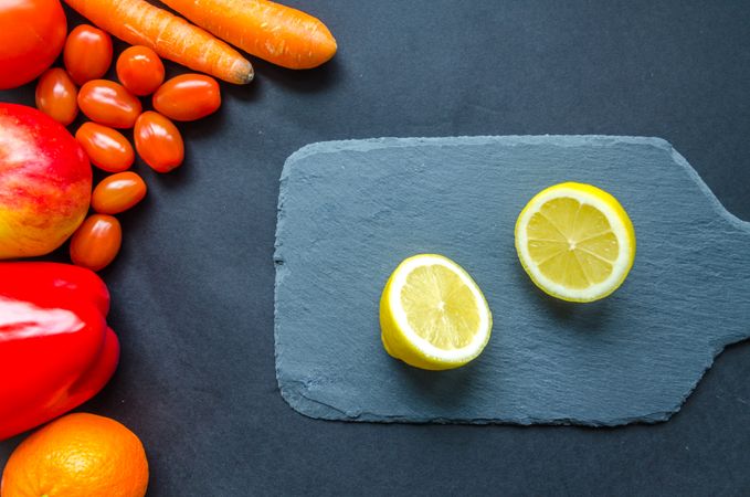 Sliced Lemon On Blue Chopping Board Photo