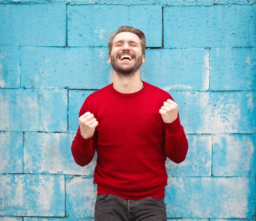 Smiling Man In Red Crew-neck Sweatshirt Photo