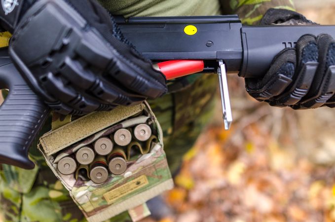Soldiers Loads Bullets In Gun Photo