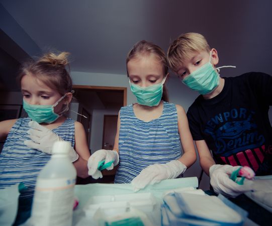 Three Children Wearing Face Masks Photo