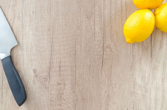 Three Lemons With Knife Photo