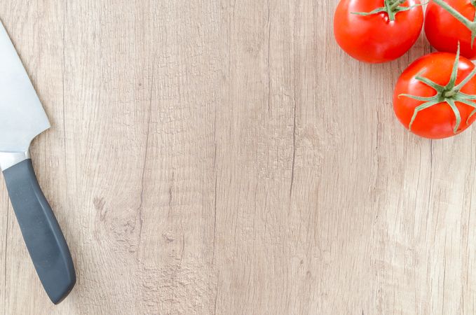Three Tomatoes With Knife Photo
