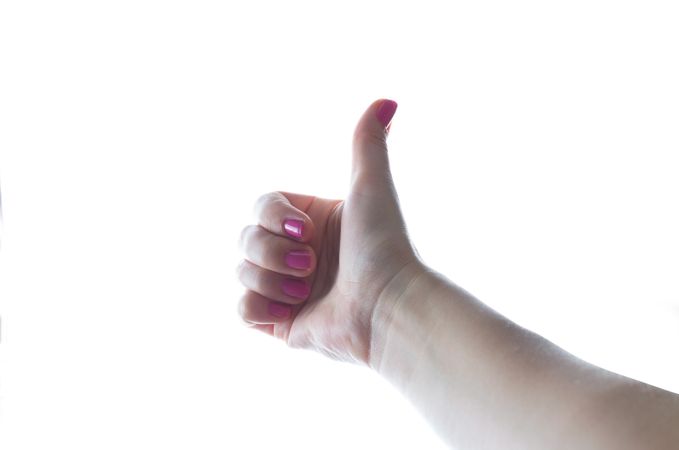 Thumbs Up Gesture By Woman Photo
