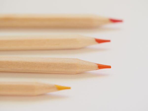 Tilt Shift Lens Photography Of Orange Coloring Tool Photo