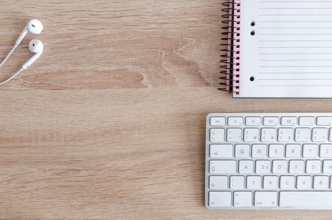 Top Angle Of White Keyboard,Earphones And Notebook Photo