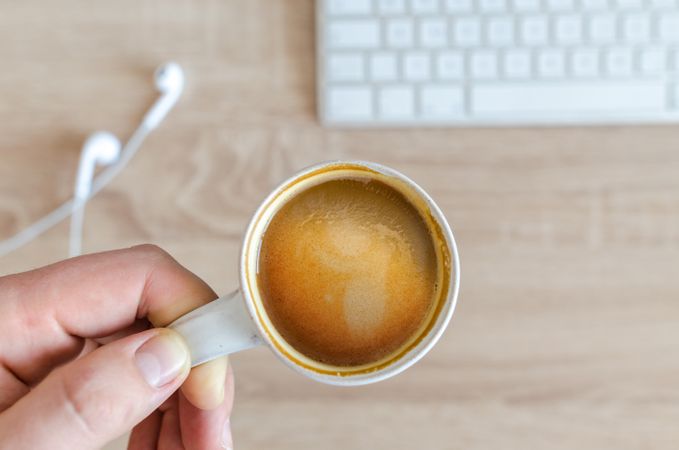 Top View Of Holding Hot Coffee Cup Photo