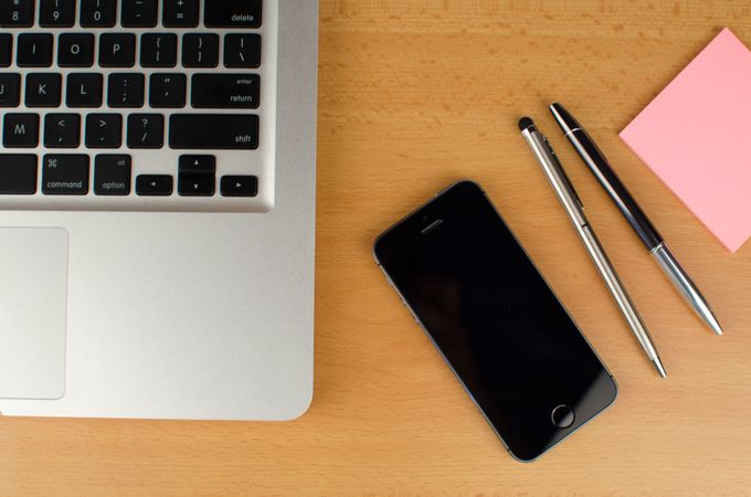 Top View Of Macbook,Iphone,Pens On Desk Photo