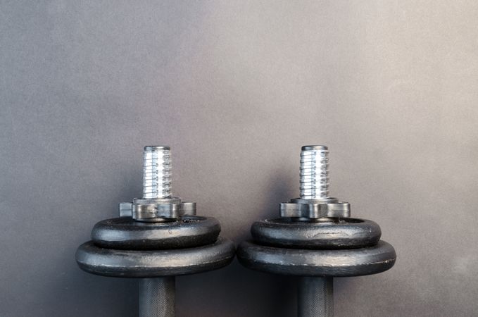 Two Dumbbells With Gray Background Photo