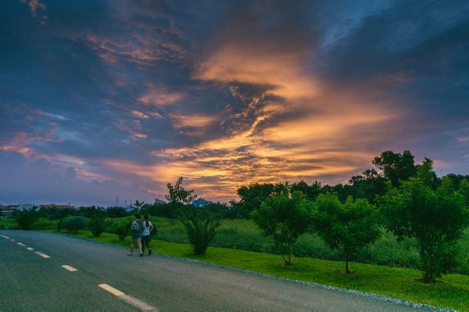 Two Woman Walking On Road And Enjoying Evening Photo