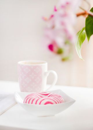 White And Pink Ceramic Mug And Doughnut In Plate Photo