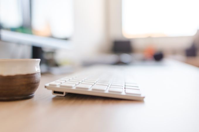 White Keyboard On Wooden Brown Table Photo