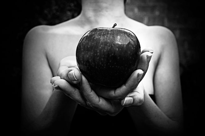 Woman Holding Apple In Hand Photo