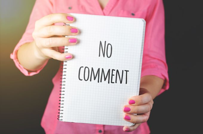 Woman Holding No Comment Signage Photo
