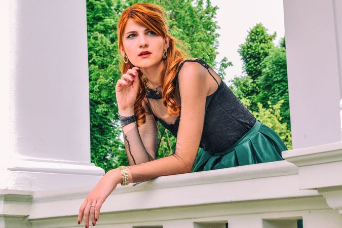 Woman In Black Top And Green Skirt With Accessories Photo