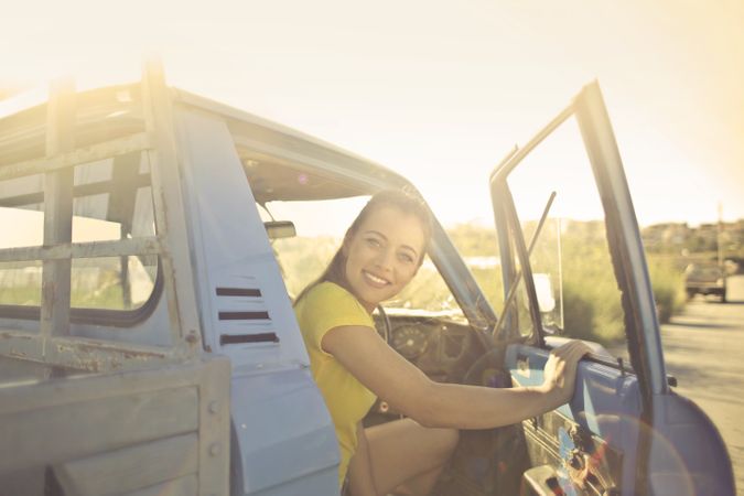 Woman Peeking Inside The Pickup Truck Photo