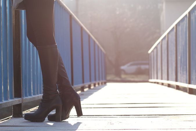 Woman Standing On Bridge Photo