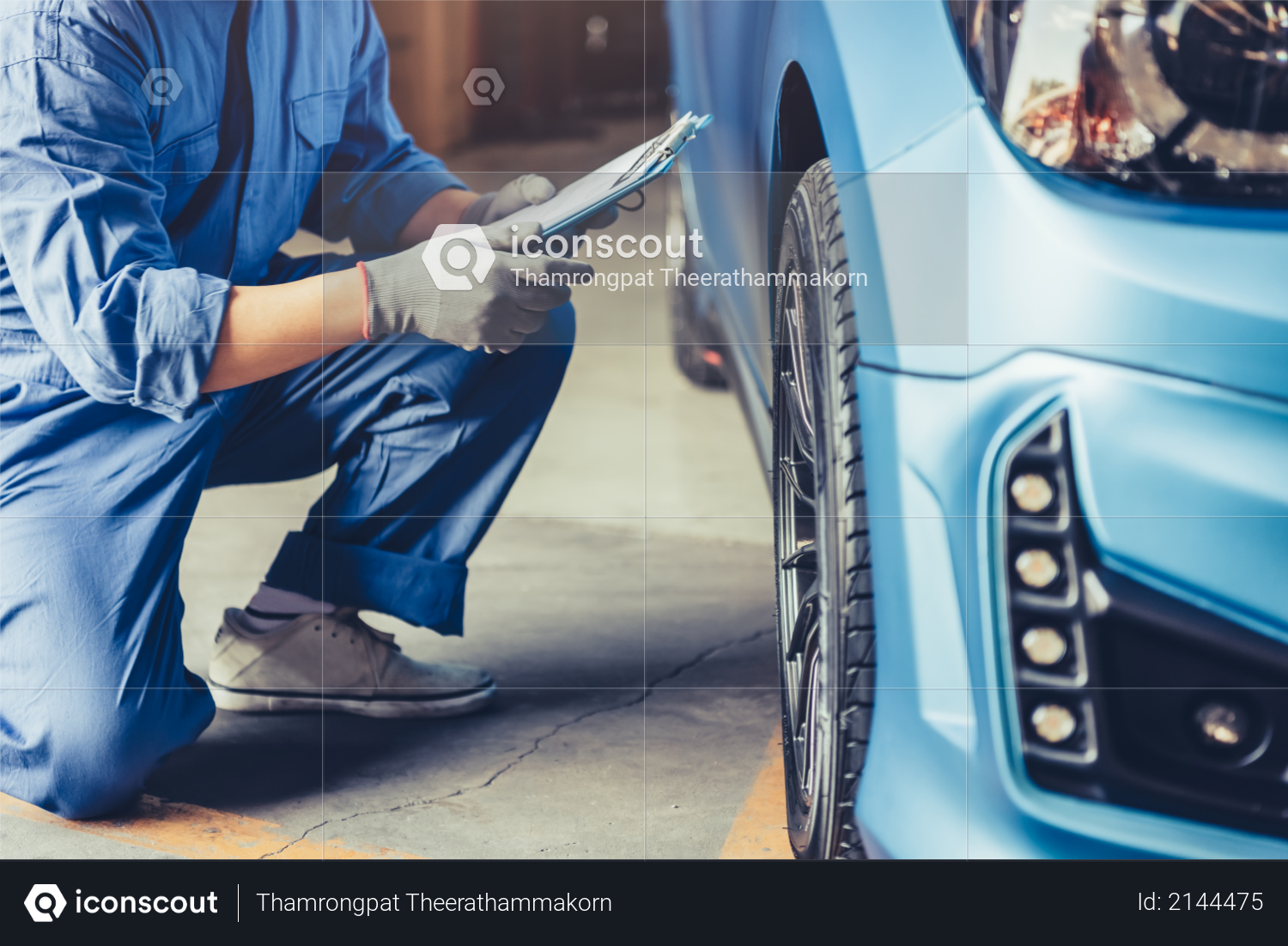 Asian car mechanic technician holding clipboard and checking to maintenance vehicle by customer claim order in auto repair shop garage, Wheel tire repair service, People occupation and business job Photo