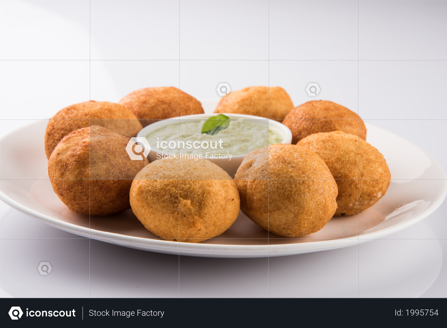 premium batata vada or aloo bonda is a tasty and popular indian tea time snack served with green chillies and tomato ketchup photo download in png jpg format iconscout