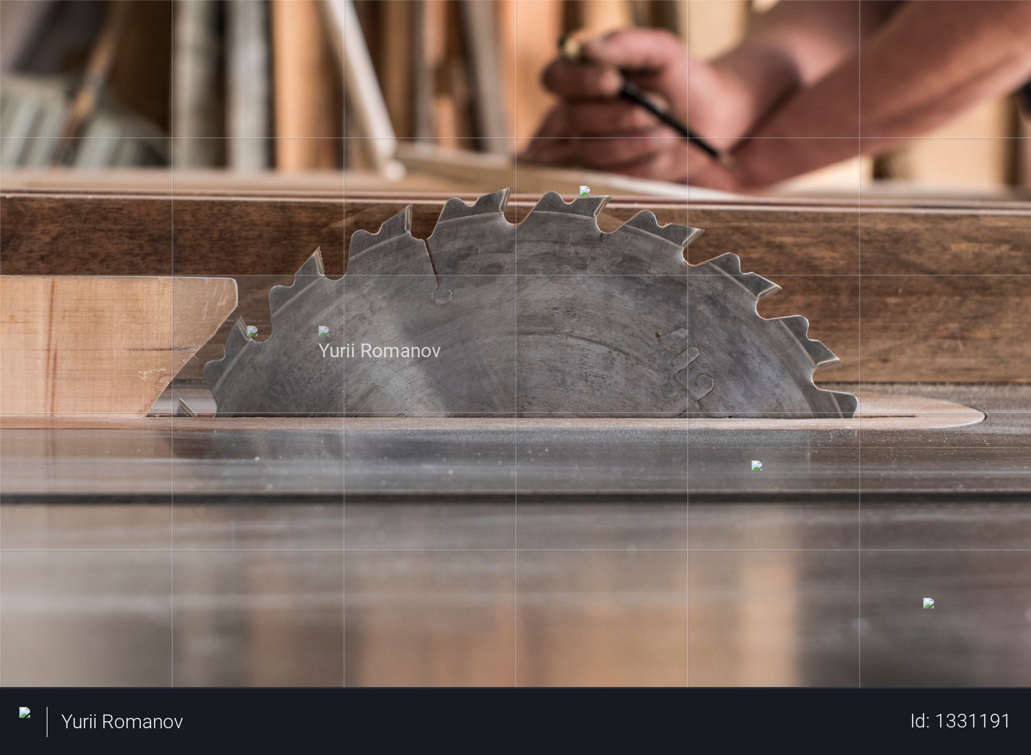 Circular saw on the background of a carpenter with a pencil marks workpieces Photo