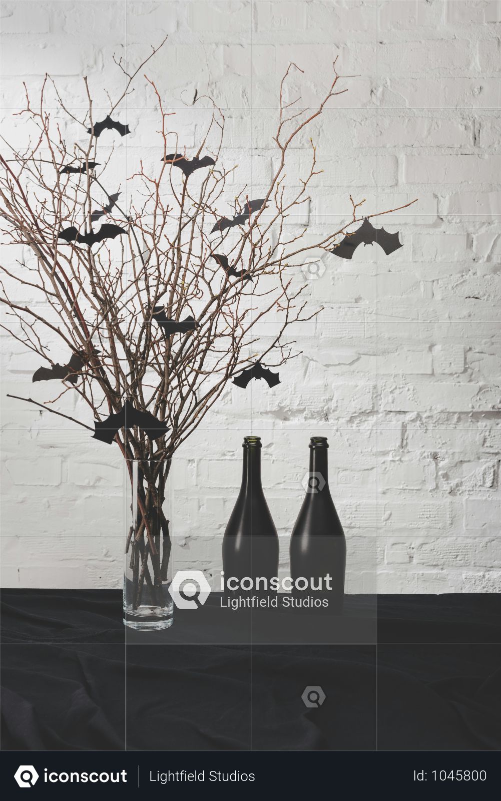 Premium Dry Branches With Bats In Vase And Black Bottles On