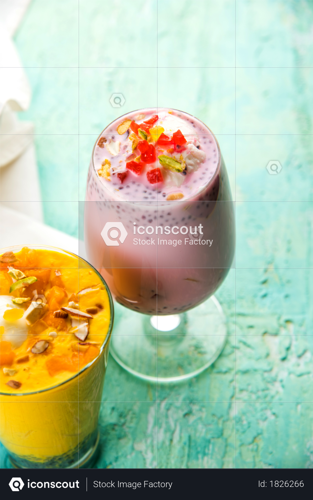 premium falooda or faluda is a popular indian dessert strawberry and mango flavoured which has ice cream noodles sweet basil seeds and nuts selective focus photo download in png jpg iconscout