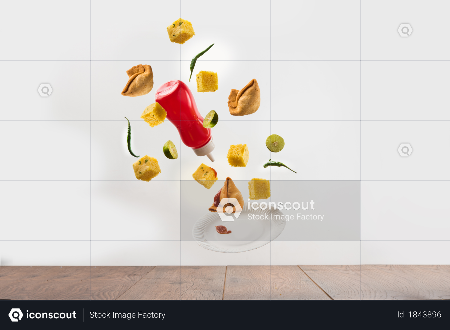 Flying samosa and dhokla with sauce and plate as junk or street food concept Photo