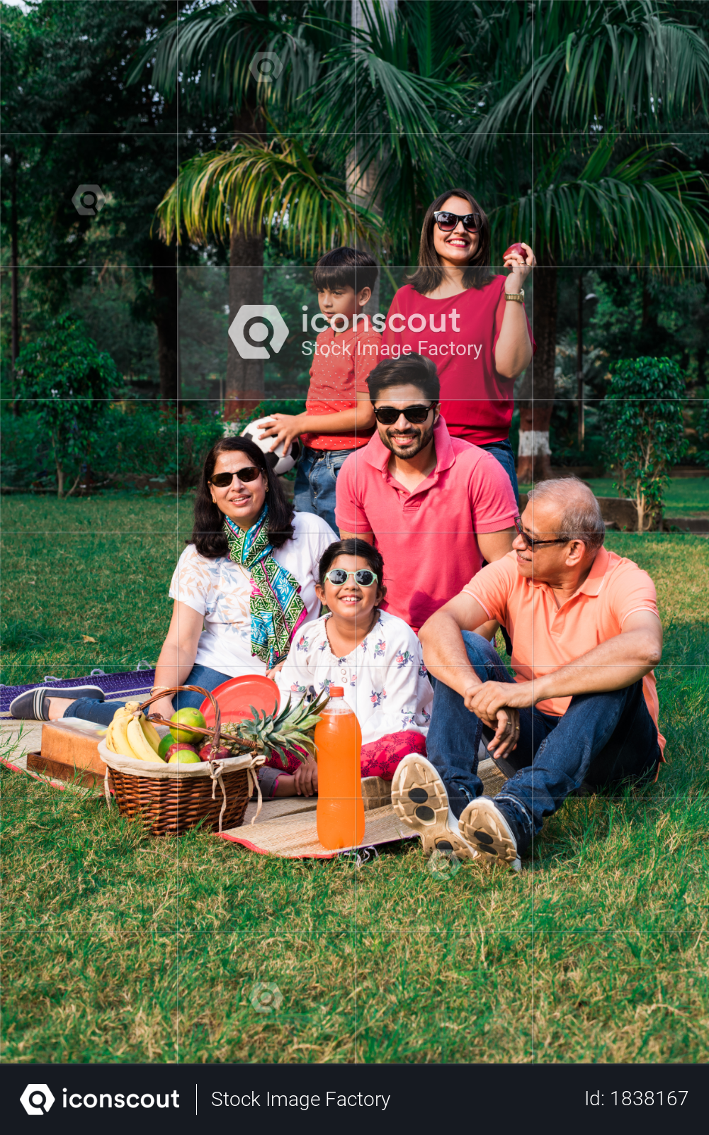 Indian Family enjoying picnic at garden Photo