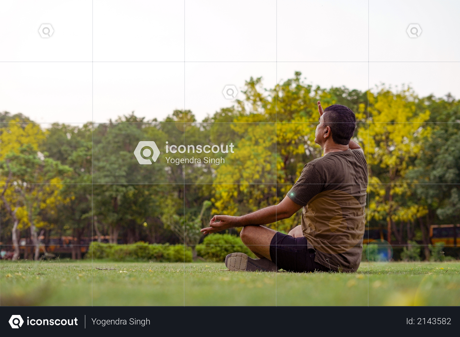 Mid-aged Man doing yoga in a park covered with trees, anulom vilom pranayam Photo