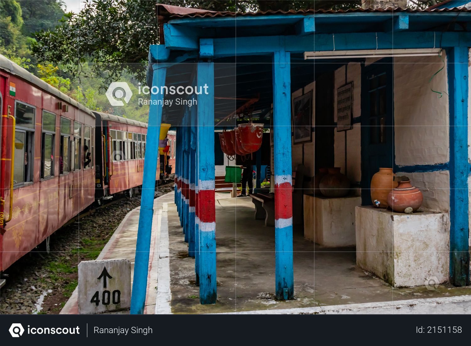 Railway station with a train passing by, travel concept Photo