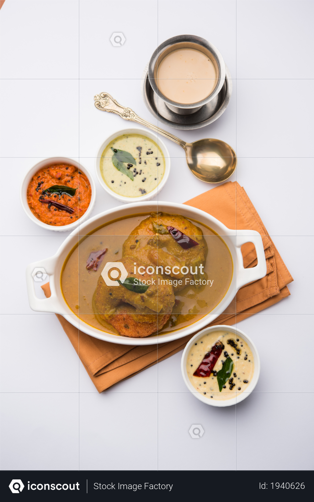 premium sambar vada also known as medu vada a popular south indian food served with green red and coconut chutney over banana leaf moody background selective focus photo download in png iconscout