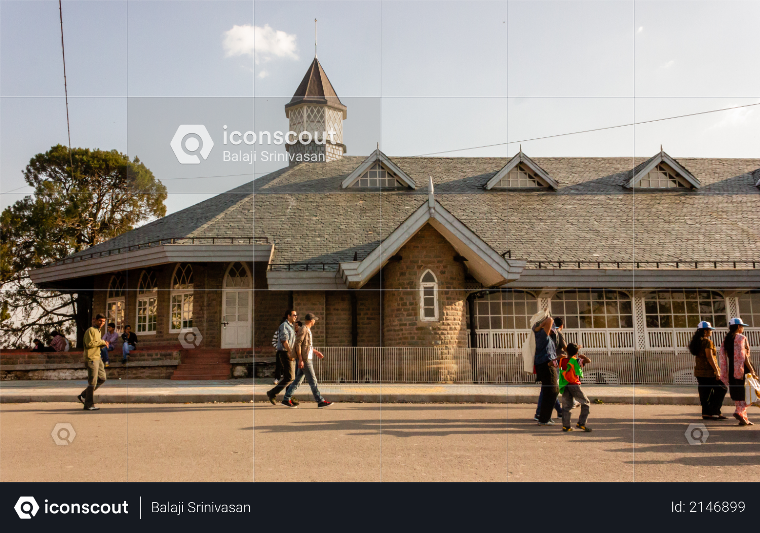 Shimla, Himachal Pradesh, India - May 2012: Tourists taking a walk on the famous Mall Road lined with British Colonial architecture. Photo
