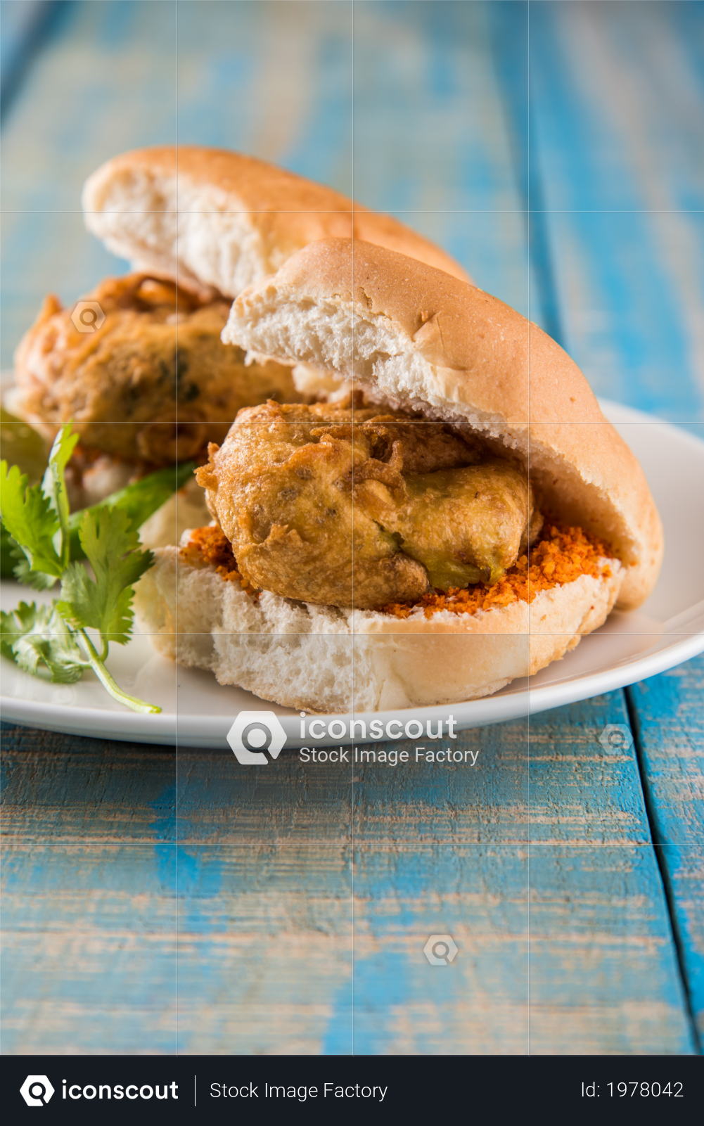 premium vada pav is an indian street food served with tomato ketchup green chili and onion over a colorful background photo download in png jpg format iconscout