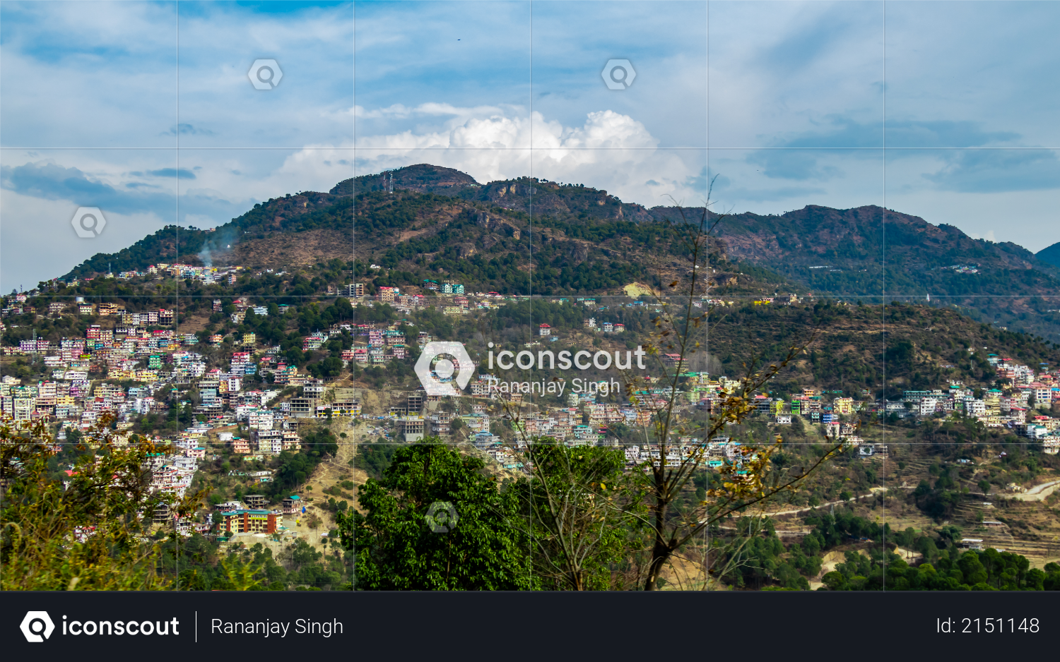 Wide shot of beautiful cityscape on mountains under the cloudy sky Photo