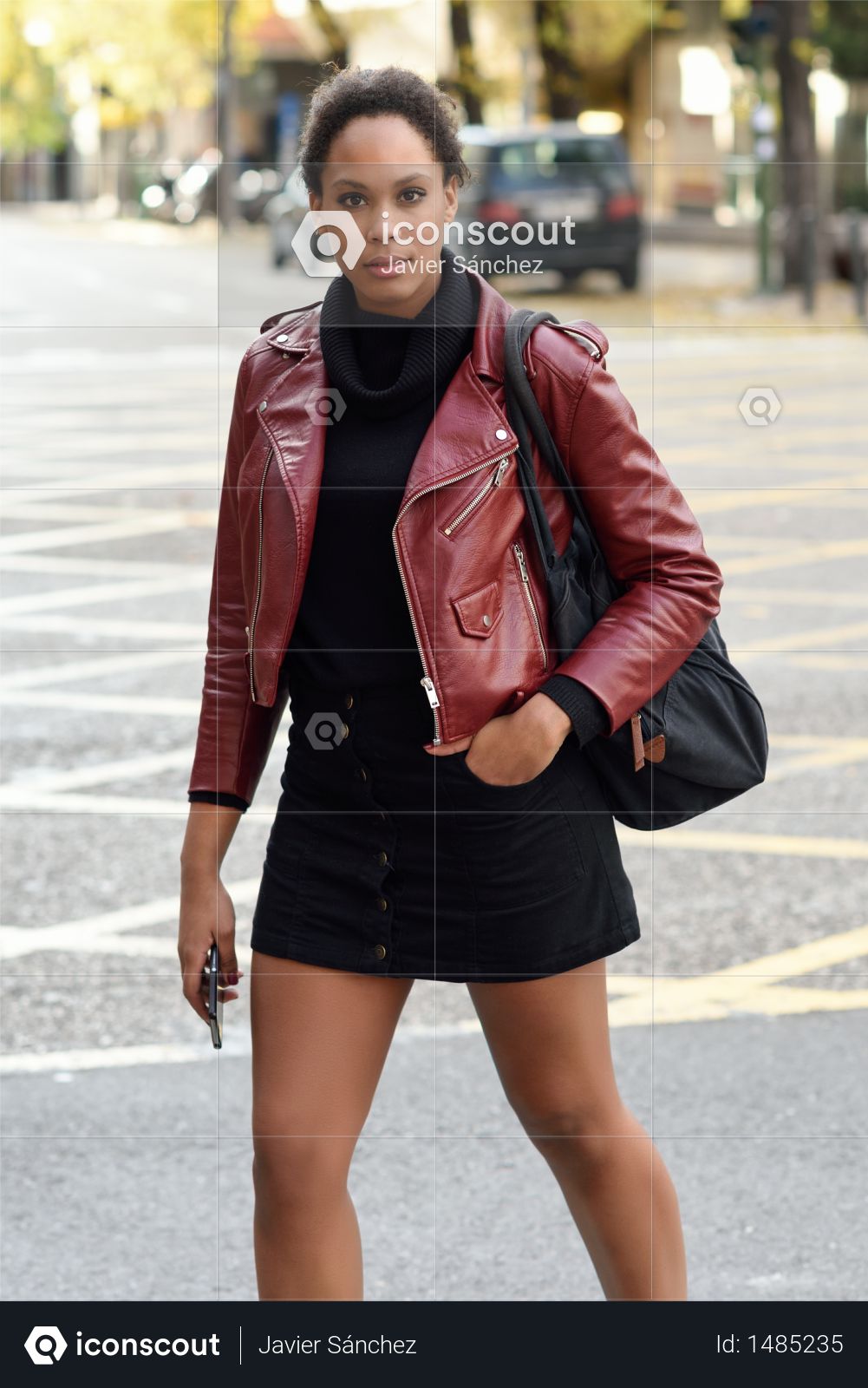 Premium Young Black Female With Afro Hairstyle Standing In An