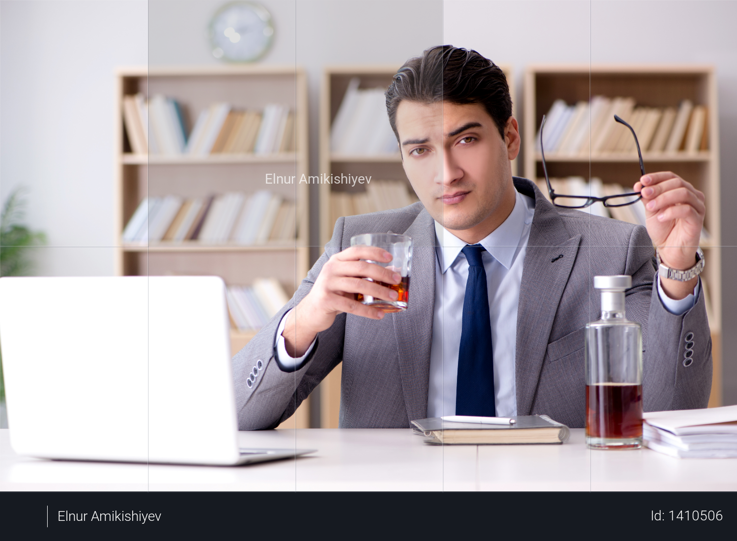 Young businessman drinking from stress Photo