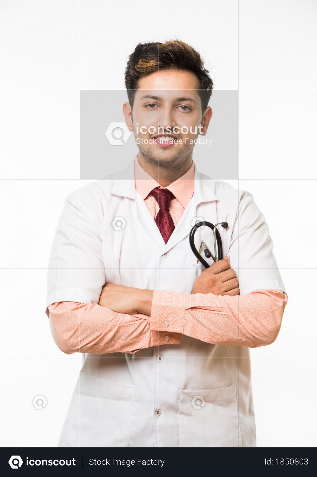 Young male doctor with stethoscope standing isolated over white background Photo