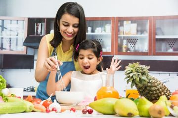 Mother And Daughter In Kitchen Shoot