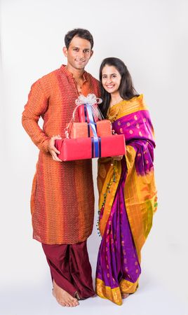 Download Premium Indian Young Couple Holding Gift Boxes Photo Pack From People Photos iconscout