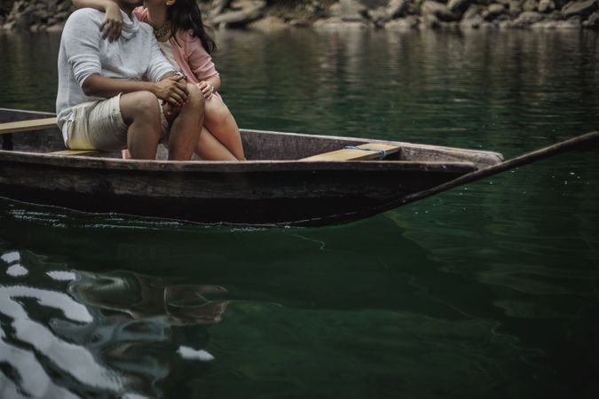 Young Couple Kissing On Boat Photo